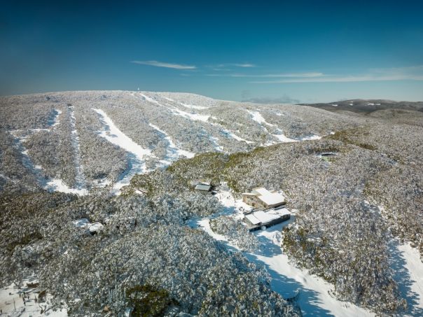 Ariel drone shot of Mt Baw Baw covered in snow