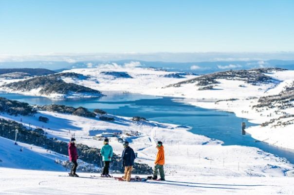 Falls Creek skiers and boarders over lake